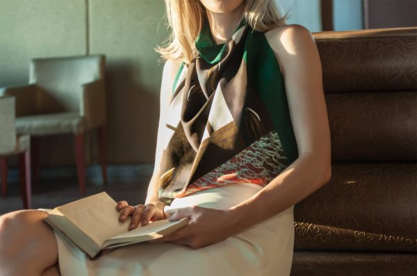 Model wearing silk green geometry scarf by tita hellas